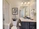 Small bathroom with shower, toilet and vanity at 6655 S Shawnee St, Aurora, CO 80016