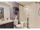 Updated bathroom features a walk-in shower and modern vanity at 6655 S Shawnee St, Aurora, CO 80016