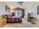 Large bedroom with queen-size bed, window, and dresser at 6655 S Shawnee St, Aurora, CO 80016