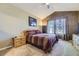 Spacious bedroom with a queen-size bed and large windows at 6655 S Shawnee St, Aurora, CO 80016