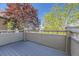 Private deck with wood flooring and treetop views at 6655 S Shawnee St, Aurora, CO 80016