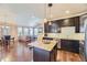 Modern kitchen with stainless steel appliances and island at 6655 S Shawnee St, Aurora, CO 80016