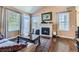 Living room with fireplace and hardwood floors at 6655 S Shawnee St, Aurora, CO 80016