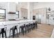 Spacious kitchen with large island, stainless steel appliances, and white cabinetry at 5300 Soledad Cir, Parker, CO 80134