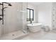 Bright bathroom with a glass shower and a free-standing tub at 5300 Soledad Cir, Parker, CO 80134