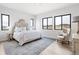 Spacious main bedroom with large windows and an ornate headboard at 5300 Soledad Cir, Parker, CO 80134