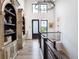 Open and bright hallway featuring a modern door and large windows at 5300 Soledad Cir, Parker, CO 80134