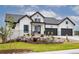 Modern farmhouse exterior with stone accents and landscaping at 5300 Soledad Cir, Parker, CO 80134