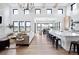 Open living room with hardwood floors, high ceilings, and stone fireplace at 5300 Soledad Cir, Parker, CO 80134