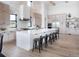 Spacious kitchen with large island, stainless steel appliances, and white cabinetry at 5300 Soledad Cir, Parker, CO 80134