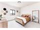 Cozy bedroom with a brown bedspread and large mirror at 5300 Soledad Cir, Parker, CO 80134