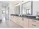 Double vanity bathroom with modern cabinets and quartz countertops at 5300 Soledad Cir, Parker, CO 80134