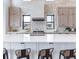 Stylish kitchen featuring a stone backsplash and modern appliances at 5300 Soledad Cir, Parker, CO 80134