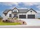 Modern farmhouse exterior with stone accents and landscaping at 5300 Soledad Cir, Parker, CO 80134