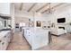 Open concept kitchen with island seating, living area views, and hardwood floors at 5300 Soledad Cir, Parker, CO 80134