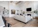 Spacious living area with stone fireplace and hardwood floors at 5300 Soledad Cir, Parker, CO 80134