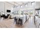 Spacious living room with high ceilings, hardwood floors and open concept kitchen view at 5300 Soledad Cir, Parker, CO 80134