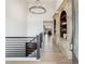 Bright and spacious entryway with elegant chandelier and built-ins at 5300 Soledad Cir, Parker, CO 80134