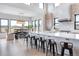 Modern kitchen with white cabinets and a large island at 5300 Soledad Cir, Parker, CO 80134