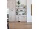 Kitchen features white cabinets, quartz countertops, and a built-in coffee bar at 5300 Soledad Cir, Parker, CO 80134