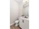 Elegant bathroom with white vanity, quartz countertop, and a frameless mirror at 5300 Soledad Cir, Parker, CO 80134
