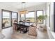 Bright dining area with large windows and seating for six at 5300 Soledad Cir, Parker, CO 80134