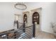 Elegant hallway with built-in bookcases and a modern chandelier at 5300 Soledad Cir, Parker, CO 80134