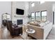 Cozy living room featuring a stone fireplace and hardwood floors at 5300 Soledad Cir, Parker, CO 80134