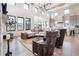 Bright and airy living room with hardwood floors and a stone fireplace at 5300 Soledad Cir, Parker, CO 80134
