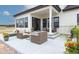 Spacious patio with wicker furniture, adjacent to house entrance at 5300 Soledad Cir, Parker, CO 80134