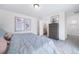 Spacious main bedroom with a king-size bed and en-suite bathroom at 13448 E 103Rd Pl, Commerce City, CO 80022