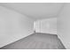 Spacious bedroom with grey carpet and dual closets at 9947 Croke Dr, Denver, CO 80260
