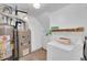 Laundry area with washer, dryer, and water heater at 9947 Croke Dr, Denver, CO 80260