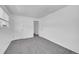Bright bedroom with grey carpet and ample closet space at 9947 Croke Dr, Denver, CO 80260