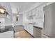 Modern kitchen with stainless steel appliances and white cabinets at 9947 Croke Dr, Denver, CO 80260
