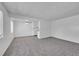 Bright and airy living room with gray carpeting and open floor plan at 9947 Croke Dr, Denver, CO 80260