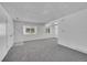 Spacious living room with gray carpet and lots of natural light at 9947 Croke Dr, Denver, CO 80260