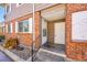 Brick building with a private entrance and landscaping at 9947 Croke Dr, Denver, CO 80260