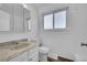 Clean bathroom featuring a vanity with a marble-look countertop at 9947 Croke Dr, Denver, CO 80260