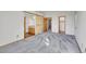 Main bedroom with barn door entry and en-suite bathroom at 6541 Devinney Ct, Arvada, CO 80004