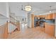 Bright kitchen with stainless steel appliances and hardwood floors at 6541 Devinney Ct, Arvada, CO 80004