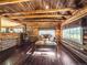 Rustic log cabin living room with wood stove and comfy seating at 9719 Beaver Pond, Conifer, CO 80433