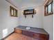Rustic bathroom with built-in toilet and electric fireplace at 9719 Beaver Pond, Conifer, CO 80433