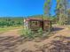 Charming log cabin nestled in a wooded mountain setting at 9719 Beaver Pond, Conifer, CO 80433