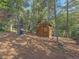 Covered outdoor kitchen area with grill and seating at 9719 Beaver Pond, Conifer, CO 80433