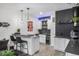 Modern basement bar with white cabinets and herringbone backsplash at 19064 W 95Th Ln, Arvada, CO 80007