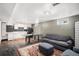 Finished basement features a kitchenette and living area at 7887 Quivas Way, Denver, CO 80221