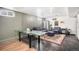 Finished basement with glass-top table and seating area at 7887 Quivas Way, Denver, CO 80221