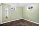 Simple basement bedroom with dark wood flooring at 7887 Quivas Way, Denver, CO 80221