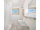 Clean bathroom with shower/tub combo, vanity, and tiled walls at 7887 Quivas Way, Denver, CO 80221